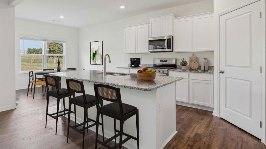 Open concept living, dining, and kitchen space