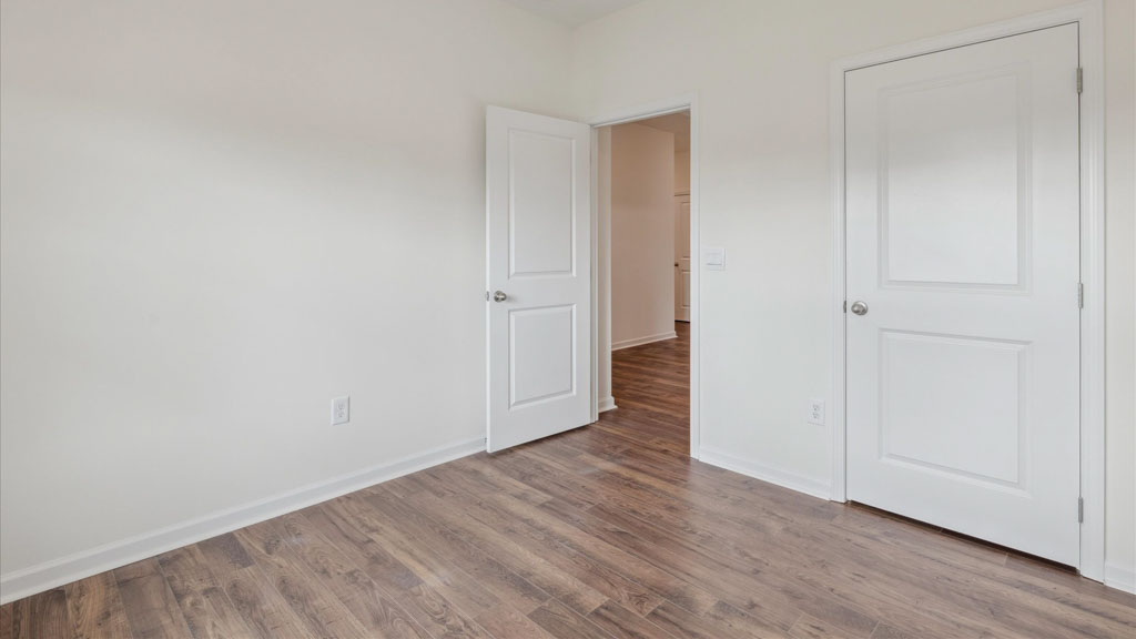 Bedroom with ample natural light and carpet floors