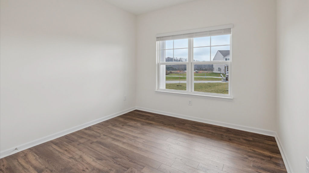 Bedroom with ample natural light and carpet floors