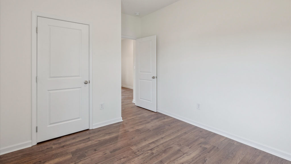 Bedroom with ample natural light and carpet floors