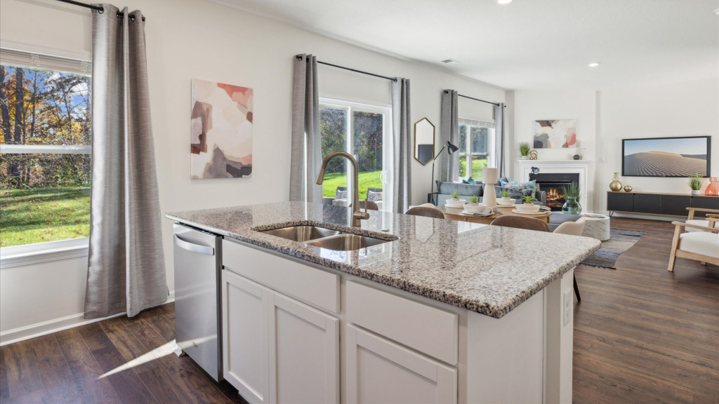 Open concept living, dining, and kitchen space