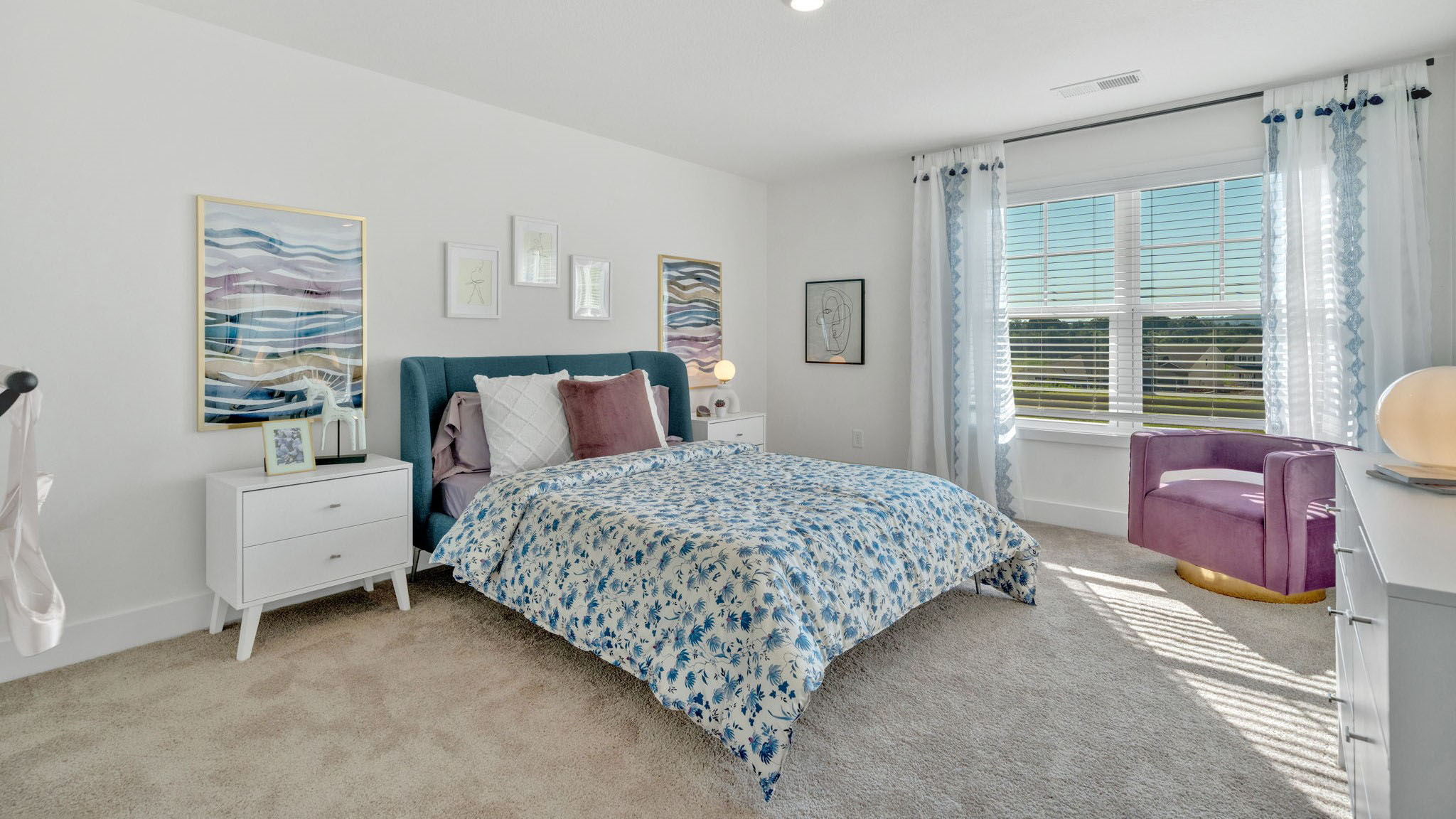 Bedroom with ample natural light and carpet floors