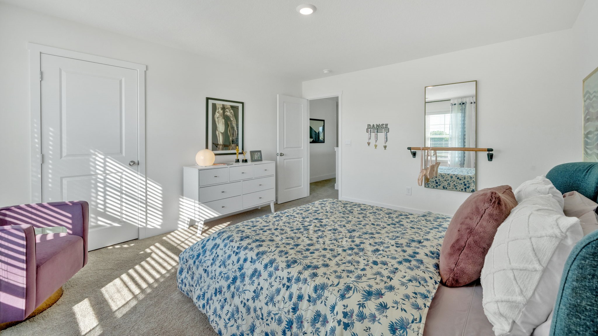 Bedroom with ample natural light and carpet floors