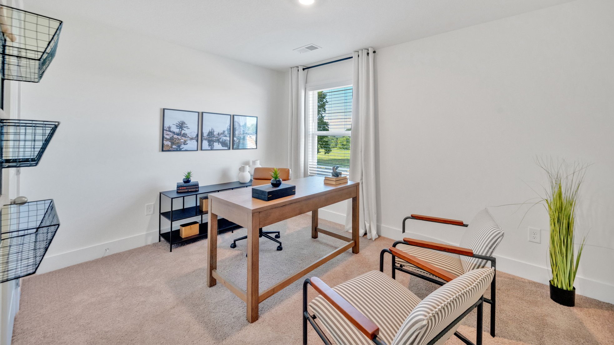 Bedroom with ample natural light and carpet floors