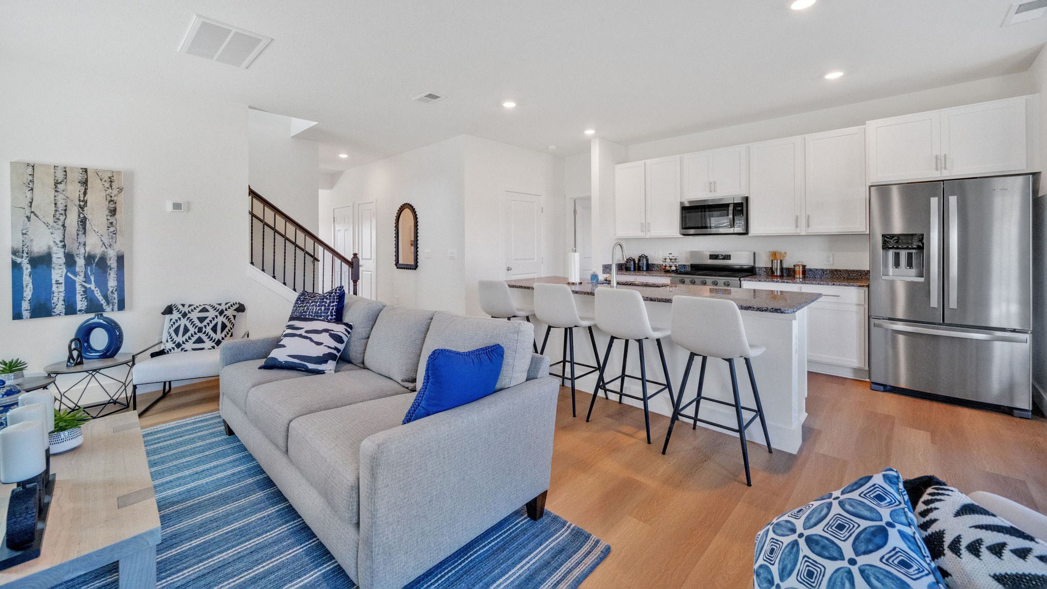 Open concept living, dining, and kitchen space