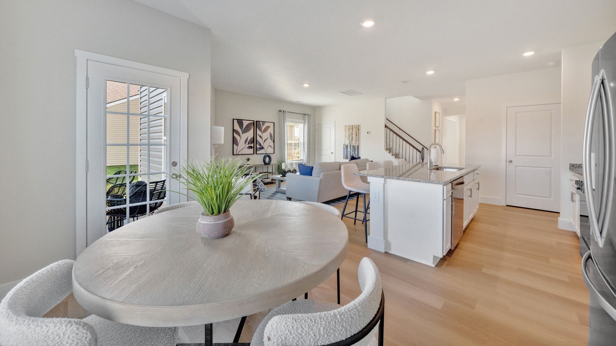 Open concept living, dining, and kitchen space