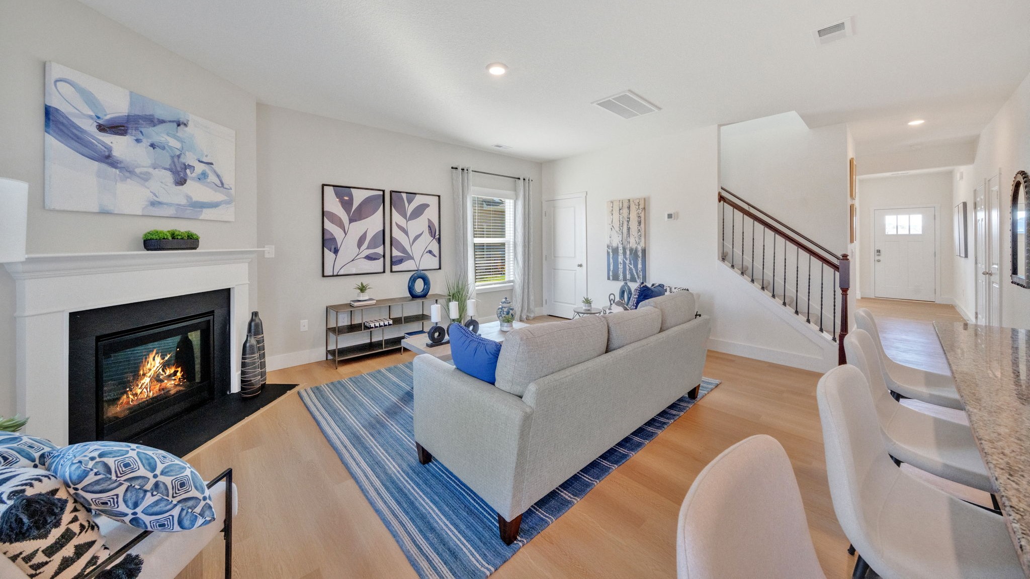 Open concept living, dining, and kitchen space