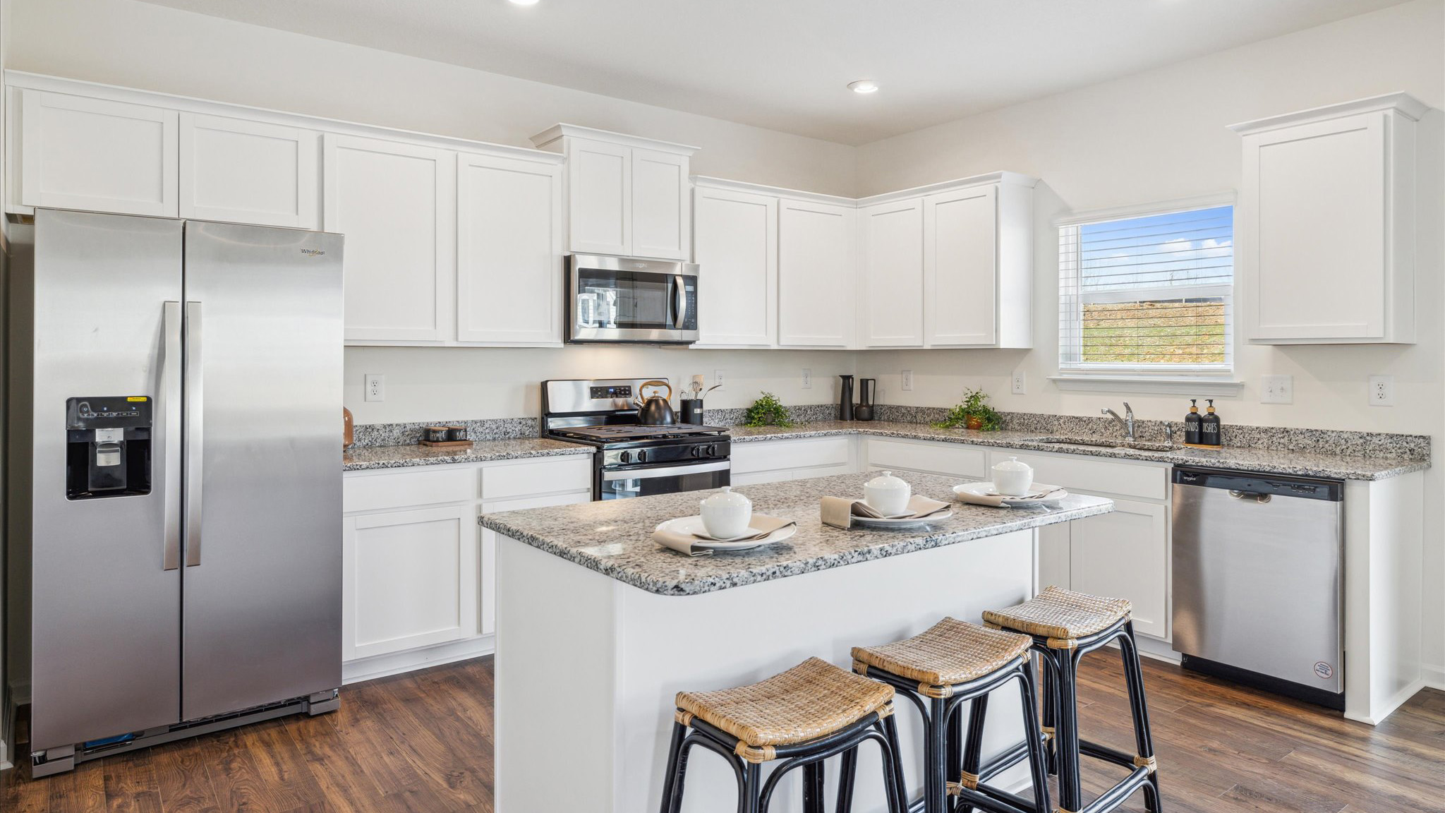 Open concept living, dining, and kitchen space