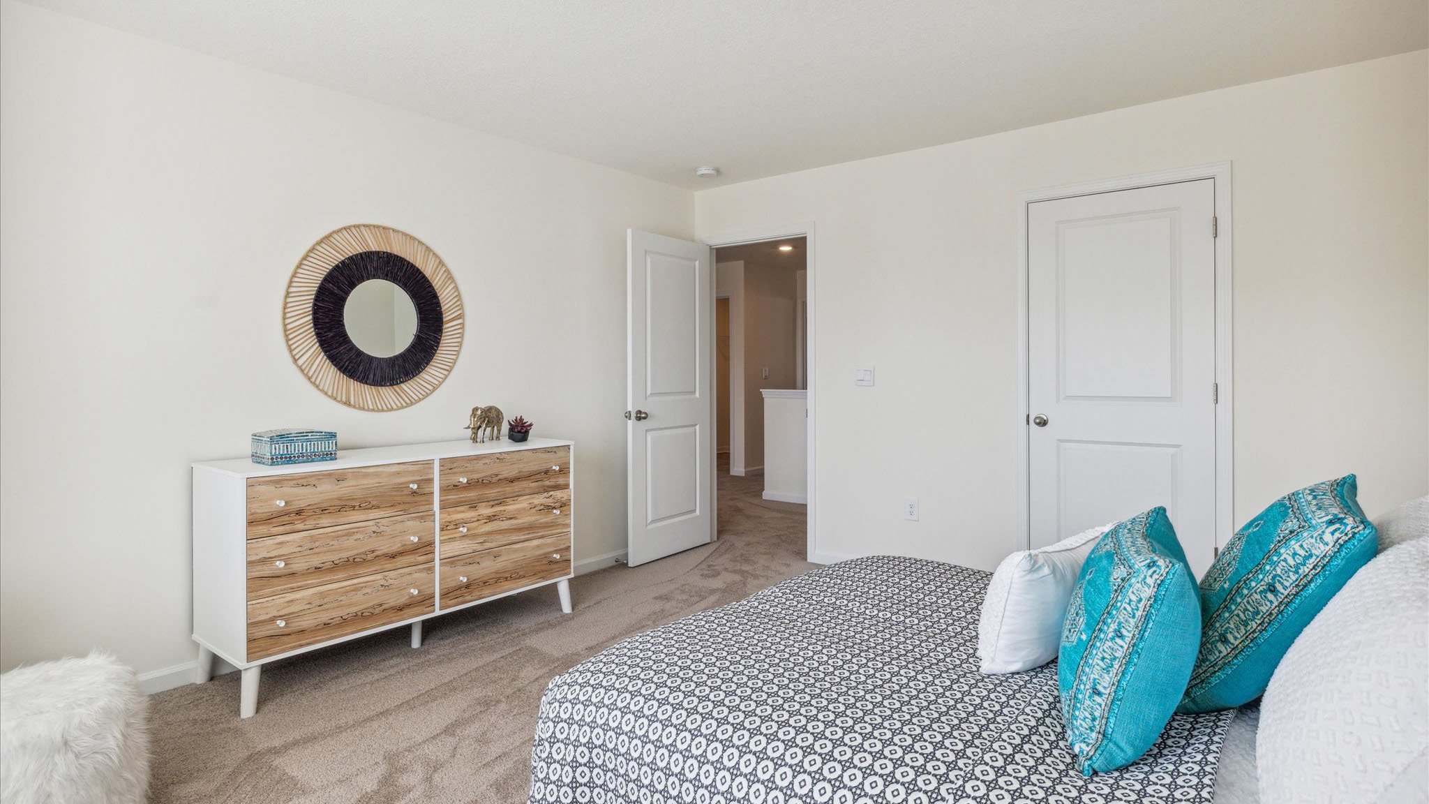 Bedroom with ample natural light and carpet floors