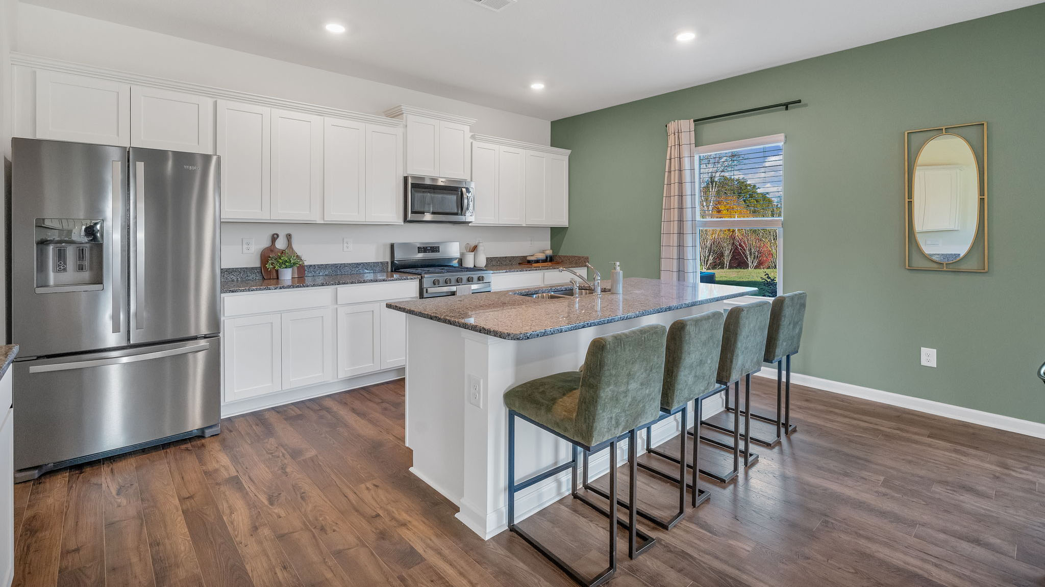 Open concept living, dining, and kitchen space