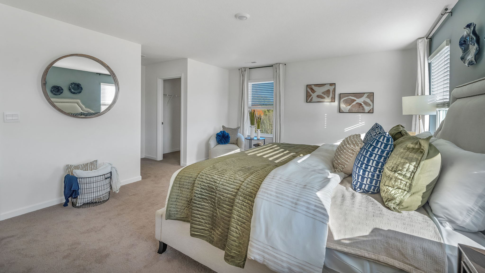 Primary bedroom with private attached bathroom and walk-in closet