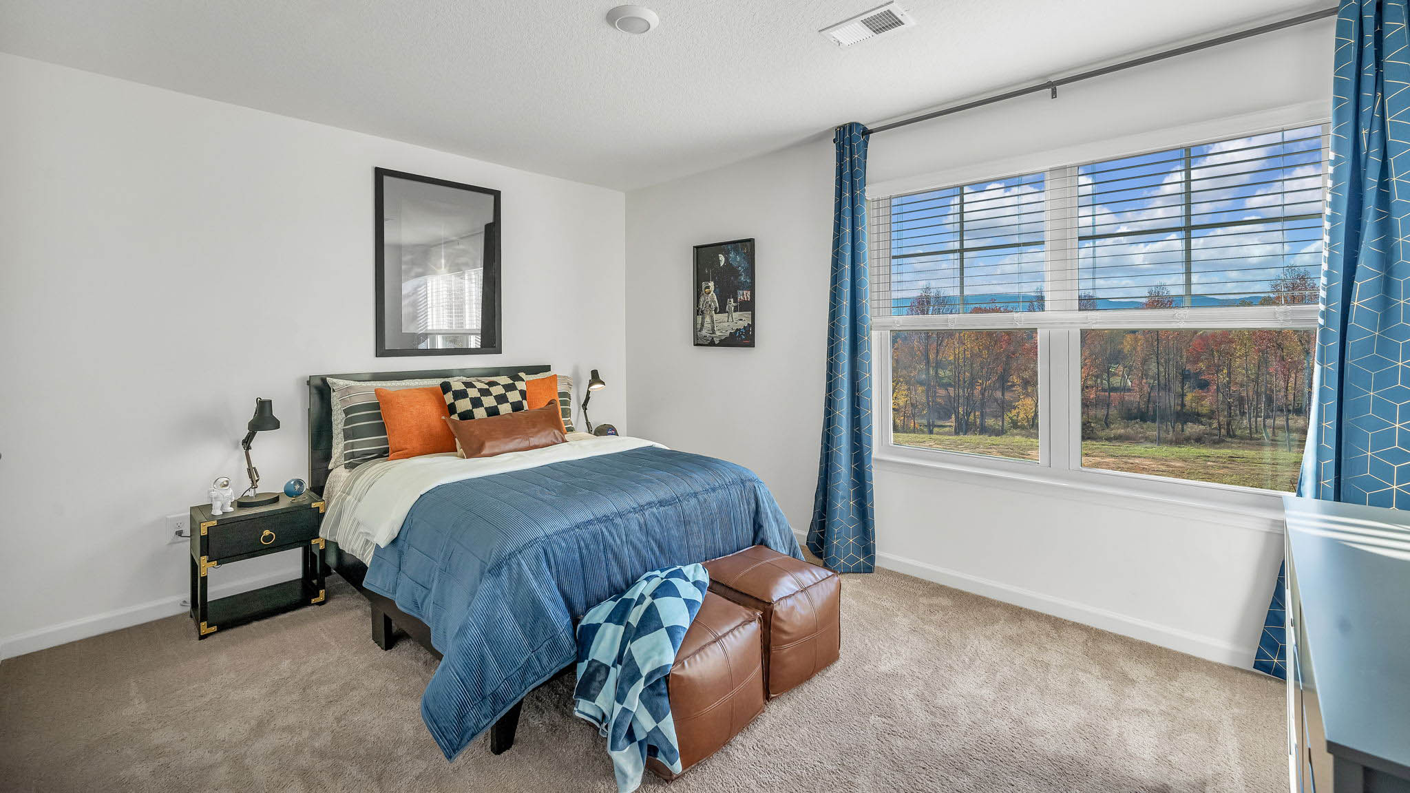 Bedroom with ample natural light and carpet floors