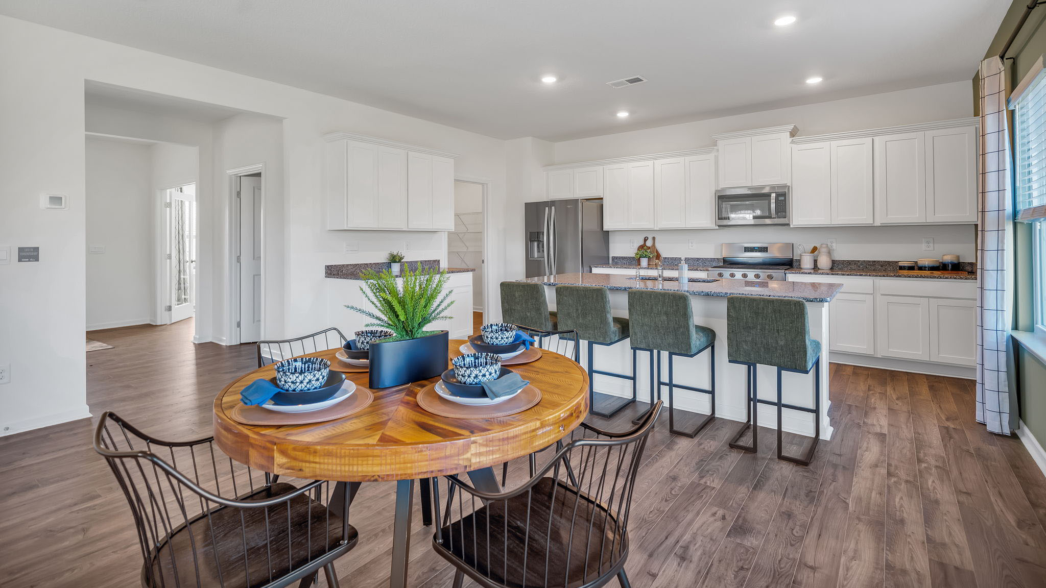 Open concept living, dining, and kitchen space