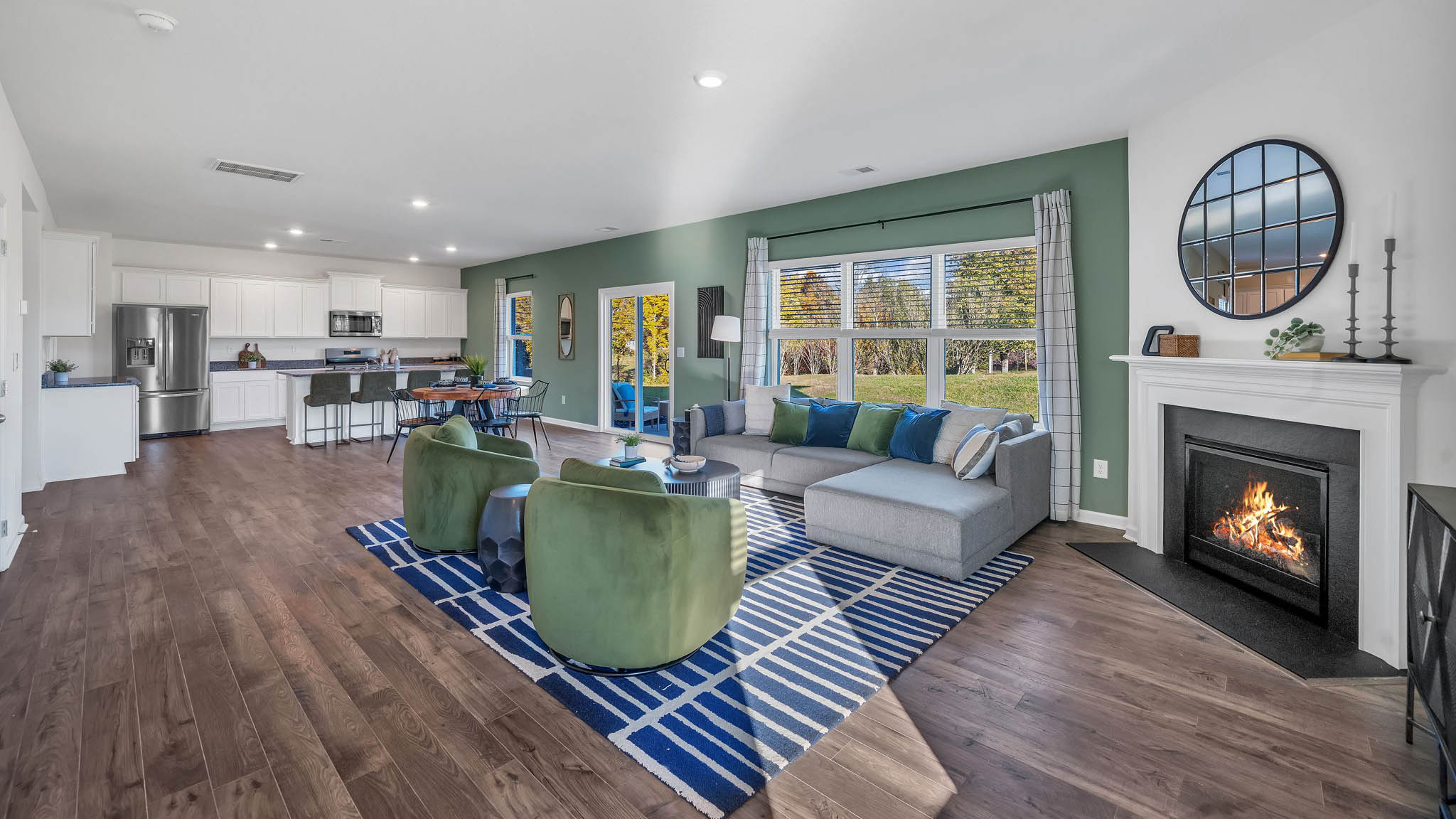 Open concept living, dining, and kitchen space