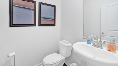 white bathroom with pedestal sink