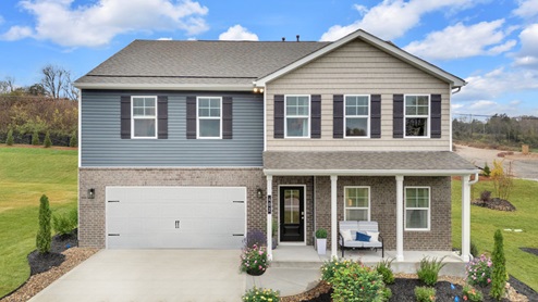 home exterior with blue vinyl siding and covered front porch