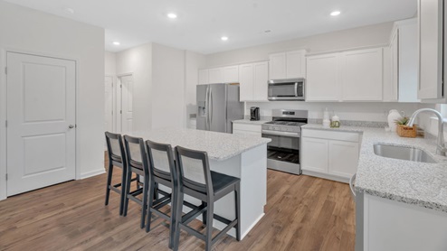 kitchen with granite countertop and peninsula