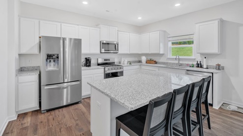 kitchen with peninsula and stainless steel appliances