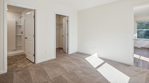 primary bedroom with white walls