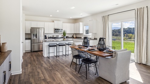 Open concept kitchen island with kitchen table