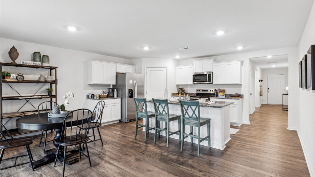 Open concept living, dining, and kitchen space