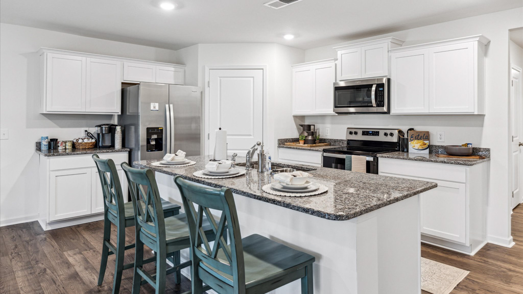 Open concept living, dining, and kitchen space