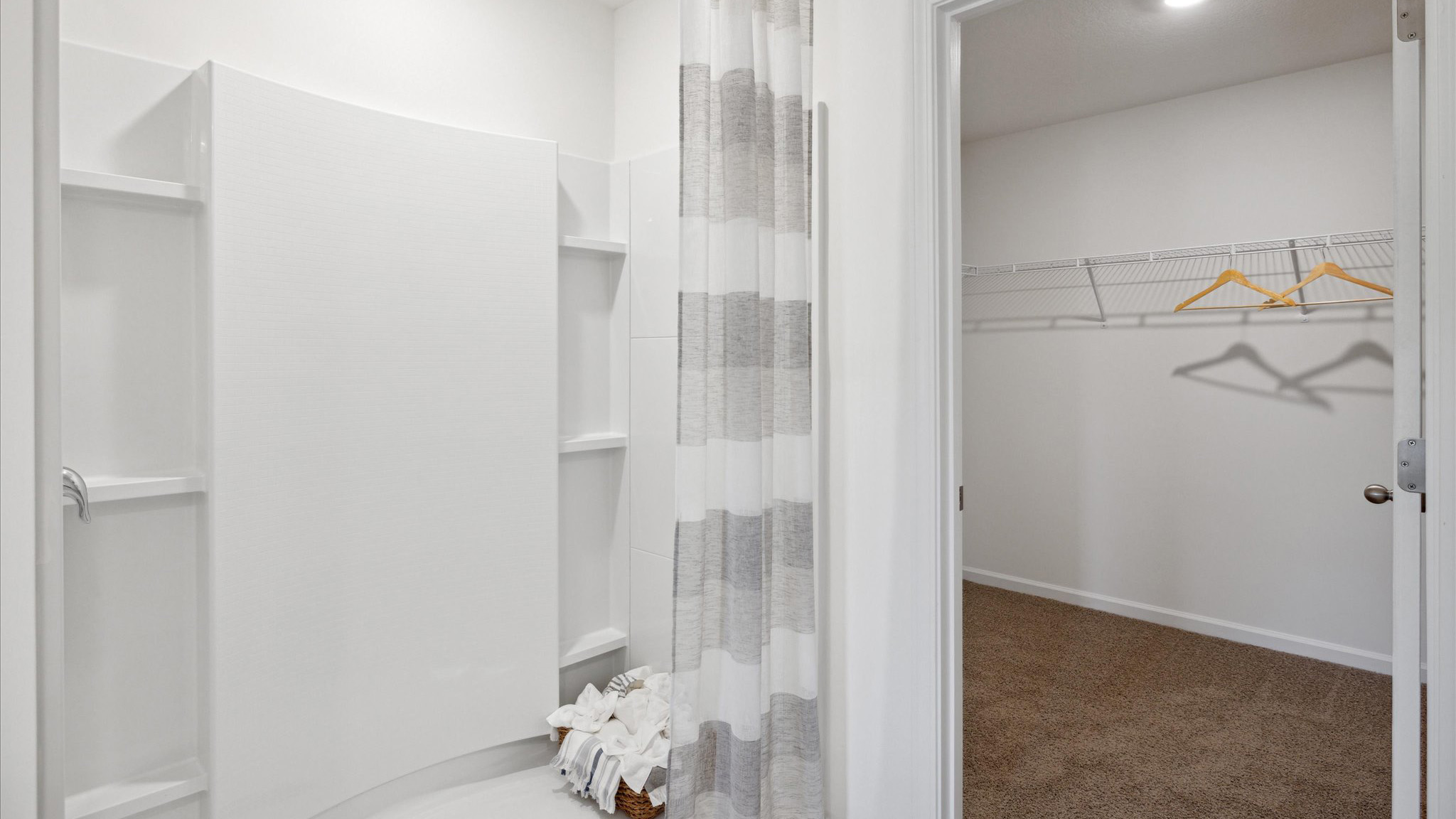 Primary bathroom with double vanity and walk-in shower