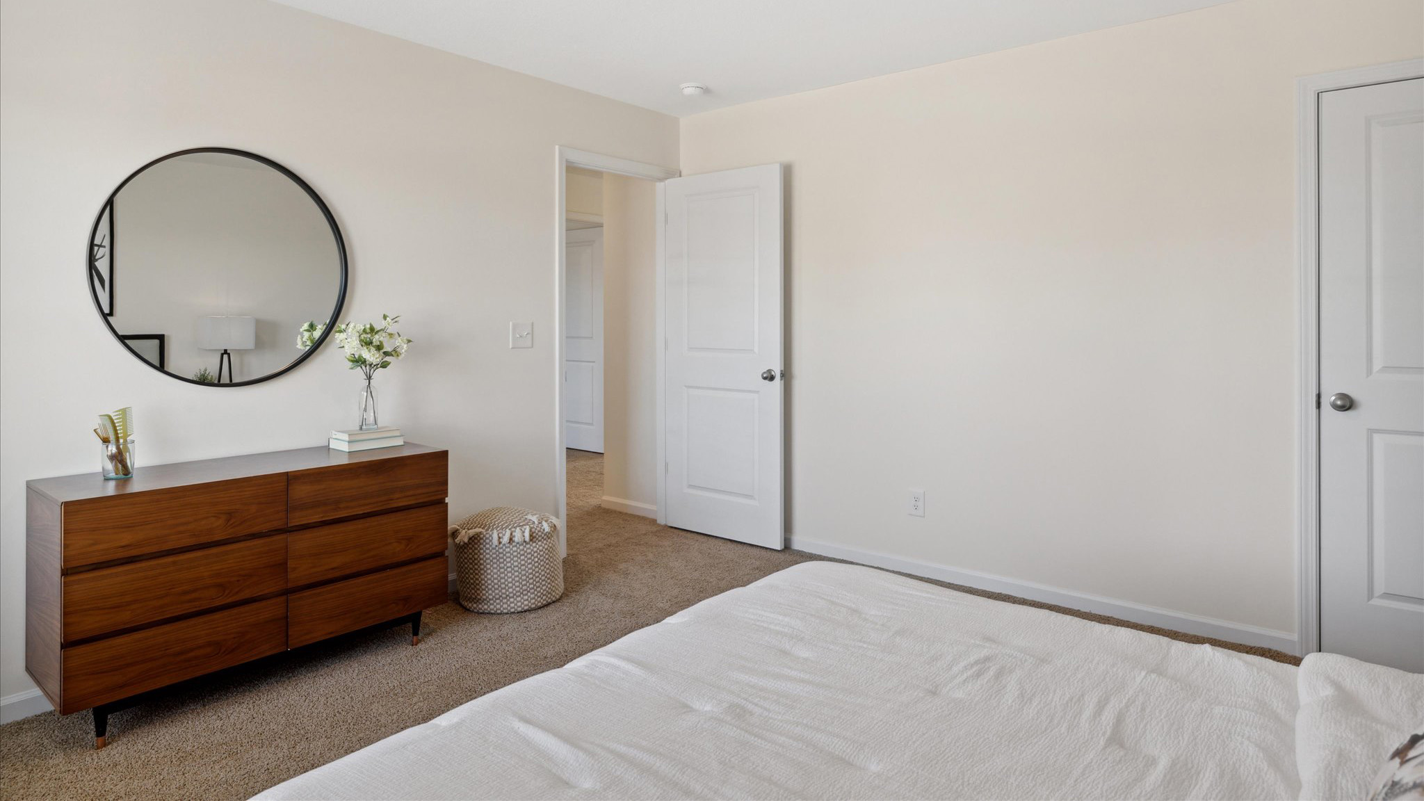 Bedroom with ample natural light and carpet floors