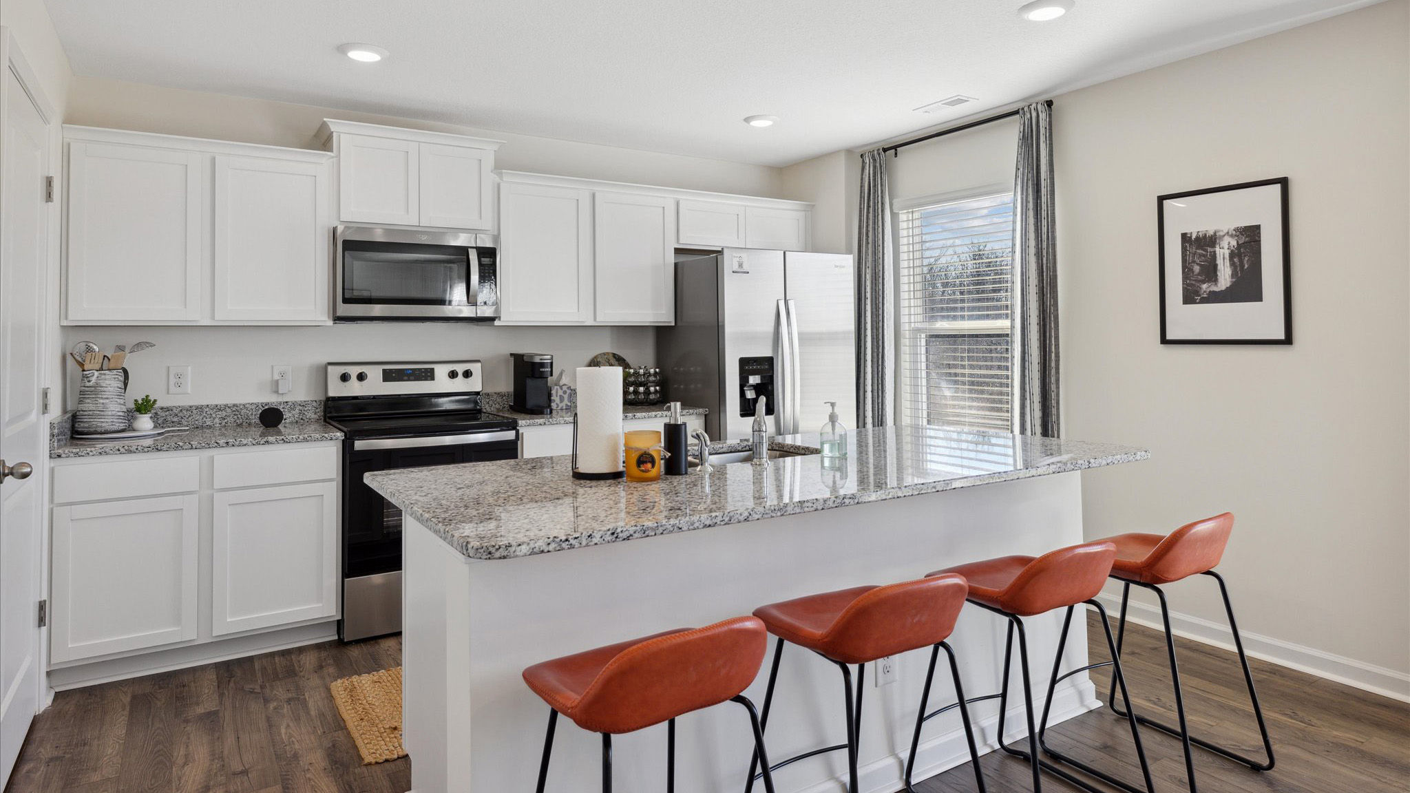 Open concept living, dining, and kitchen space