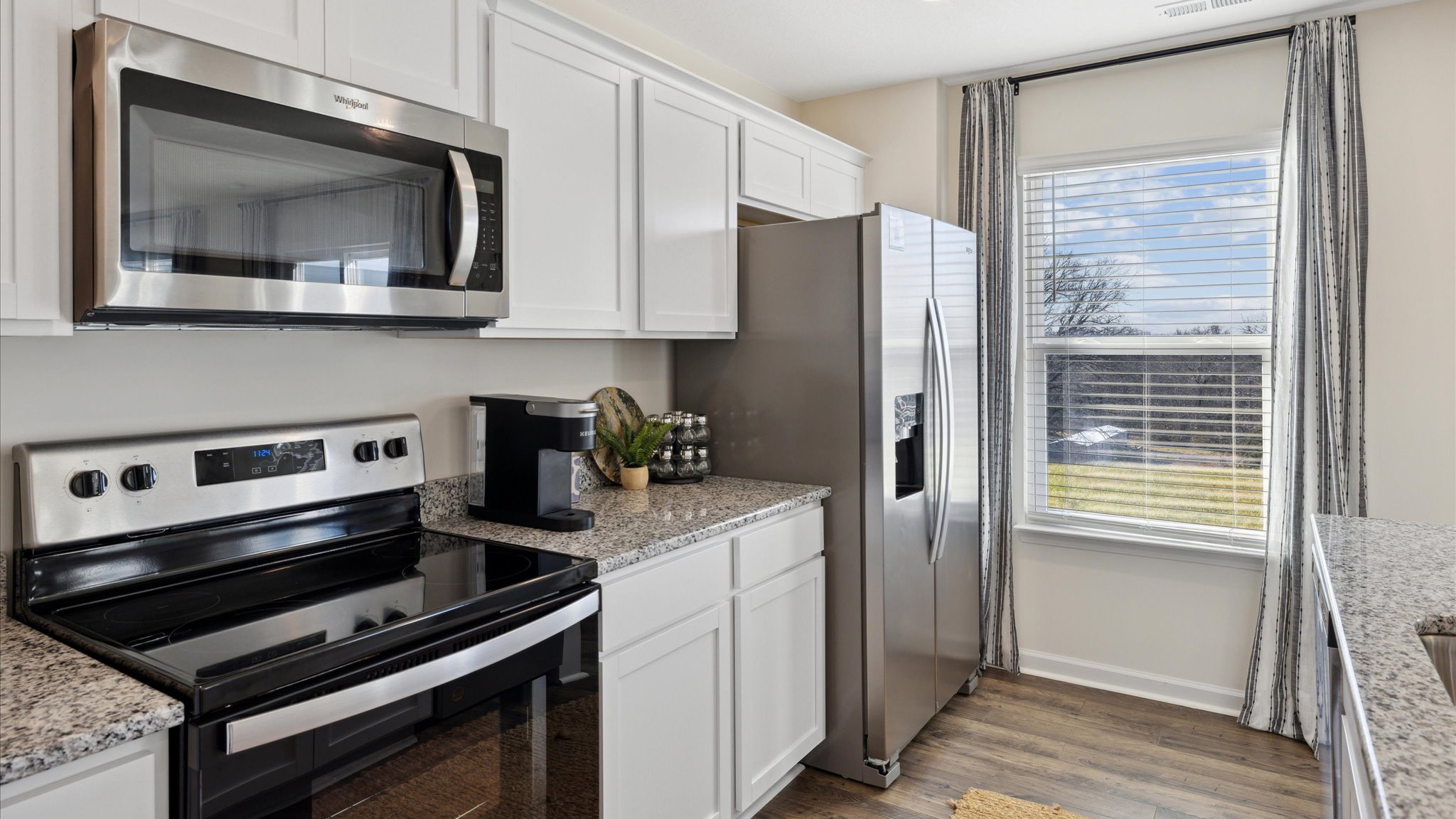 Open concept living, dining, and kitchen space