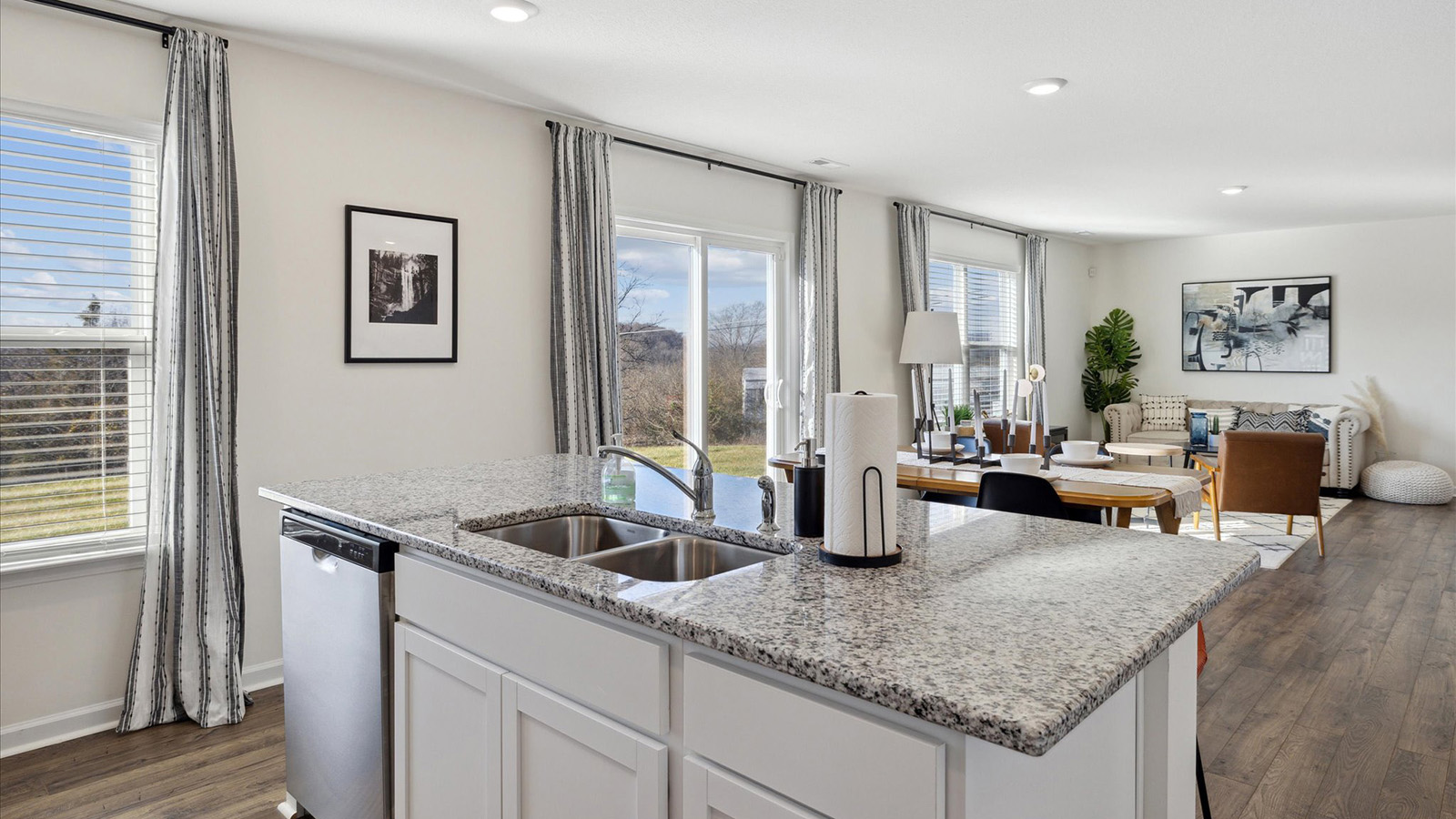 Open concept living, dining, and kitchen space