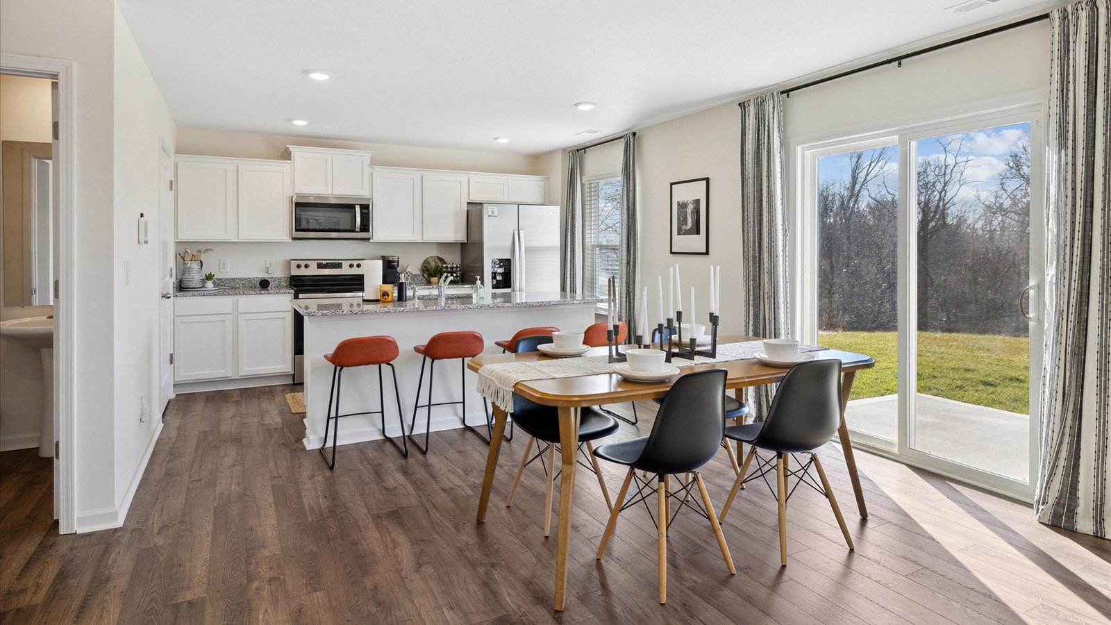 Open concept living, dining, and kitchen space