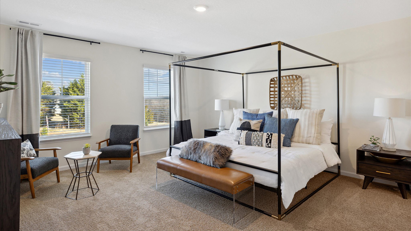 Primary bedroom with private attached bathroom and walk-in closet