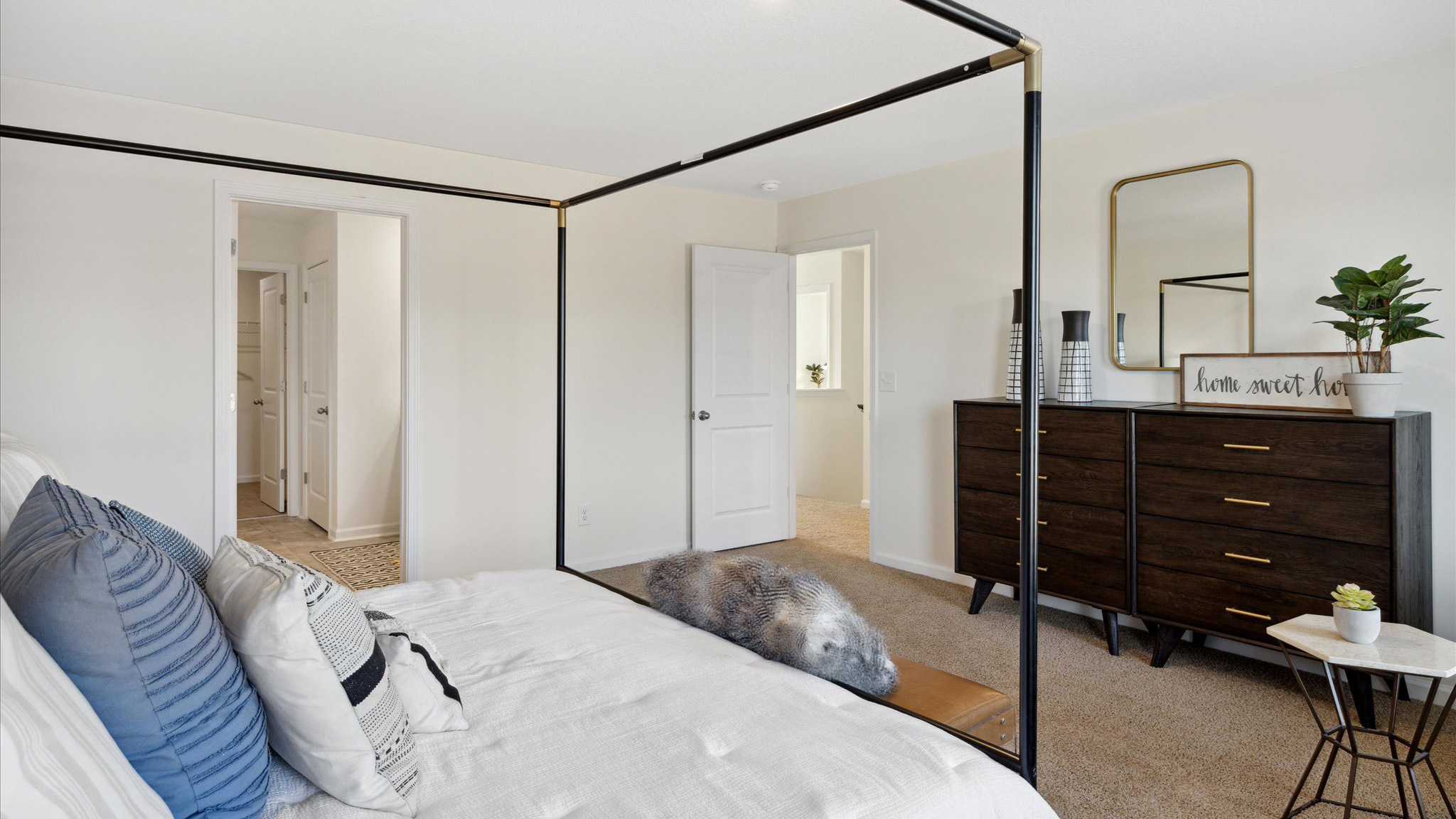 Primary bedroom with private attached bathroom and walk-in closet