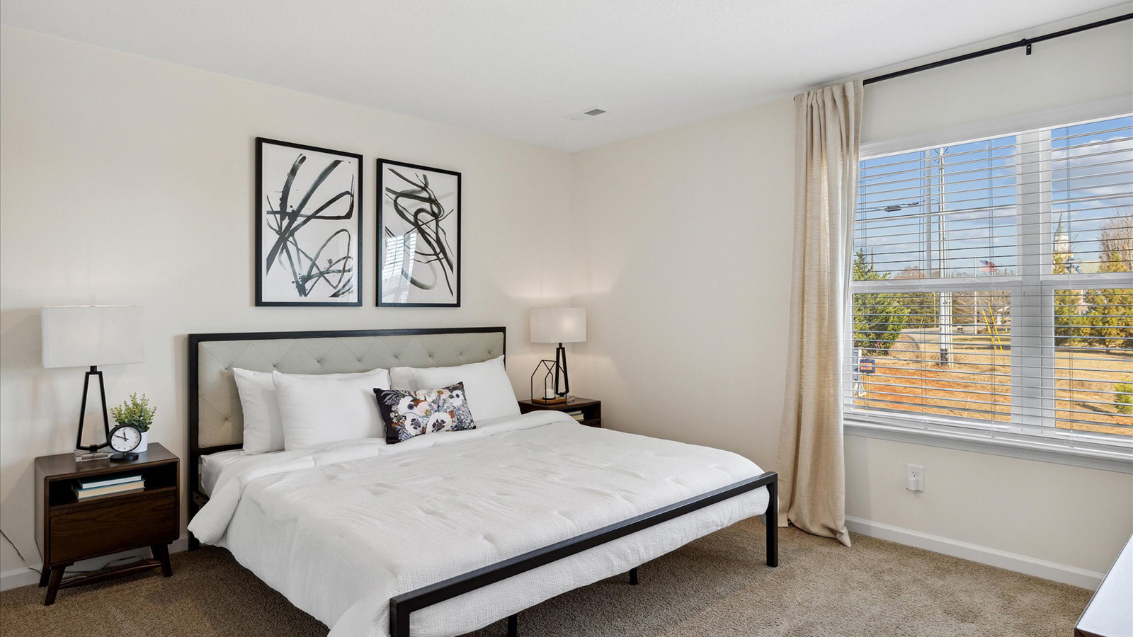 Bedroom with ample natural light and carpet floors