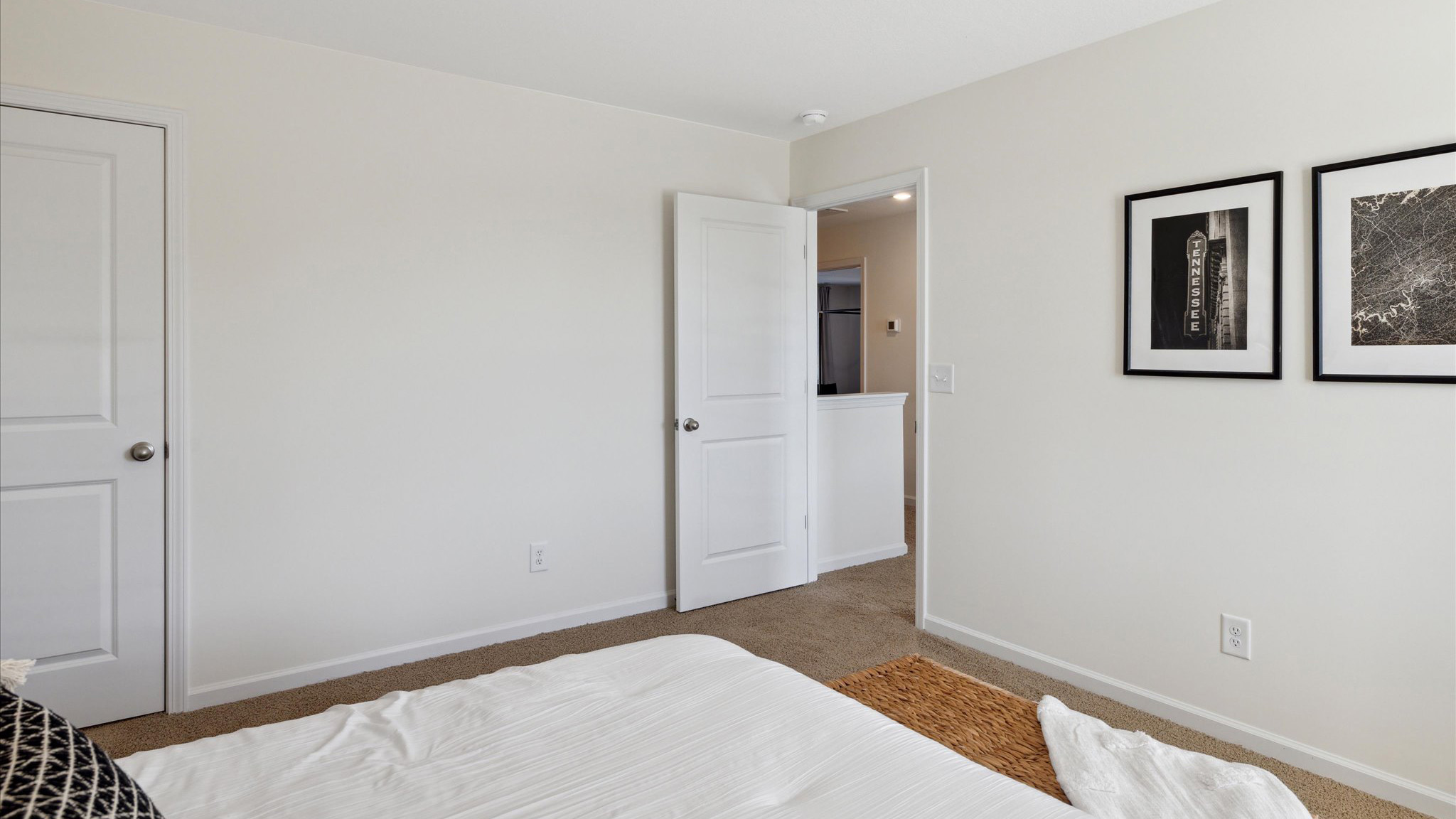 Bedroom with ample natural light and carpet floors