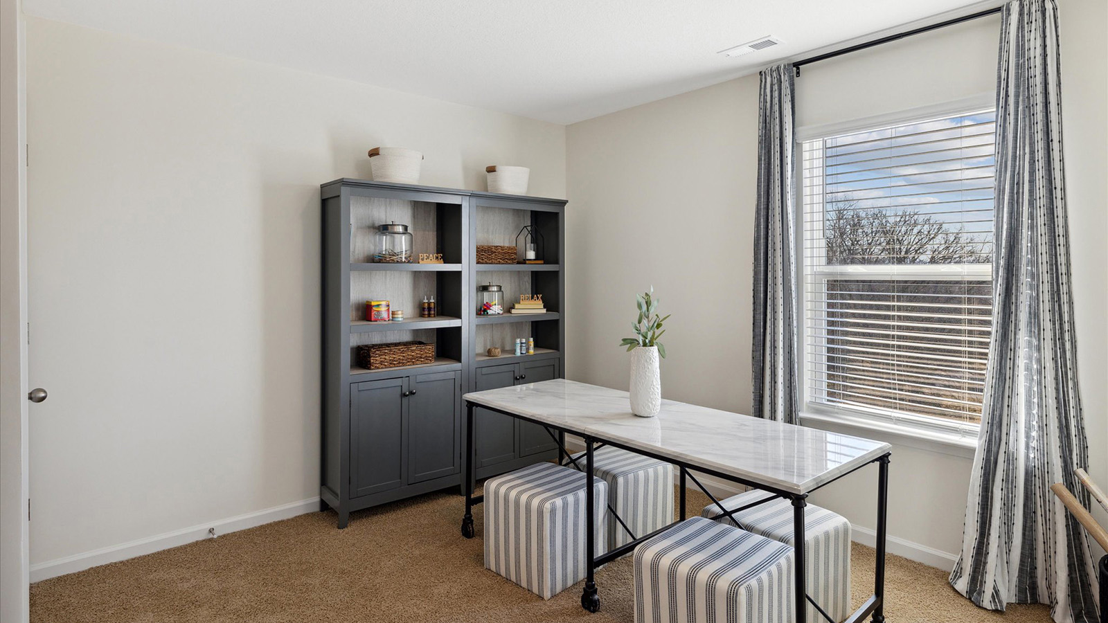 Bedroom with ample natural light and carpet floors