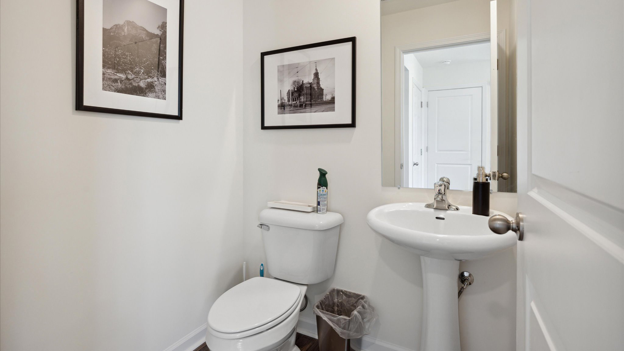 Downstairs guest half bathroom with pedestal sink
