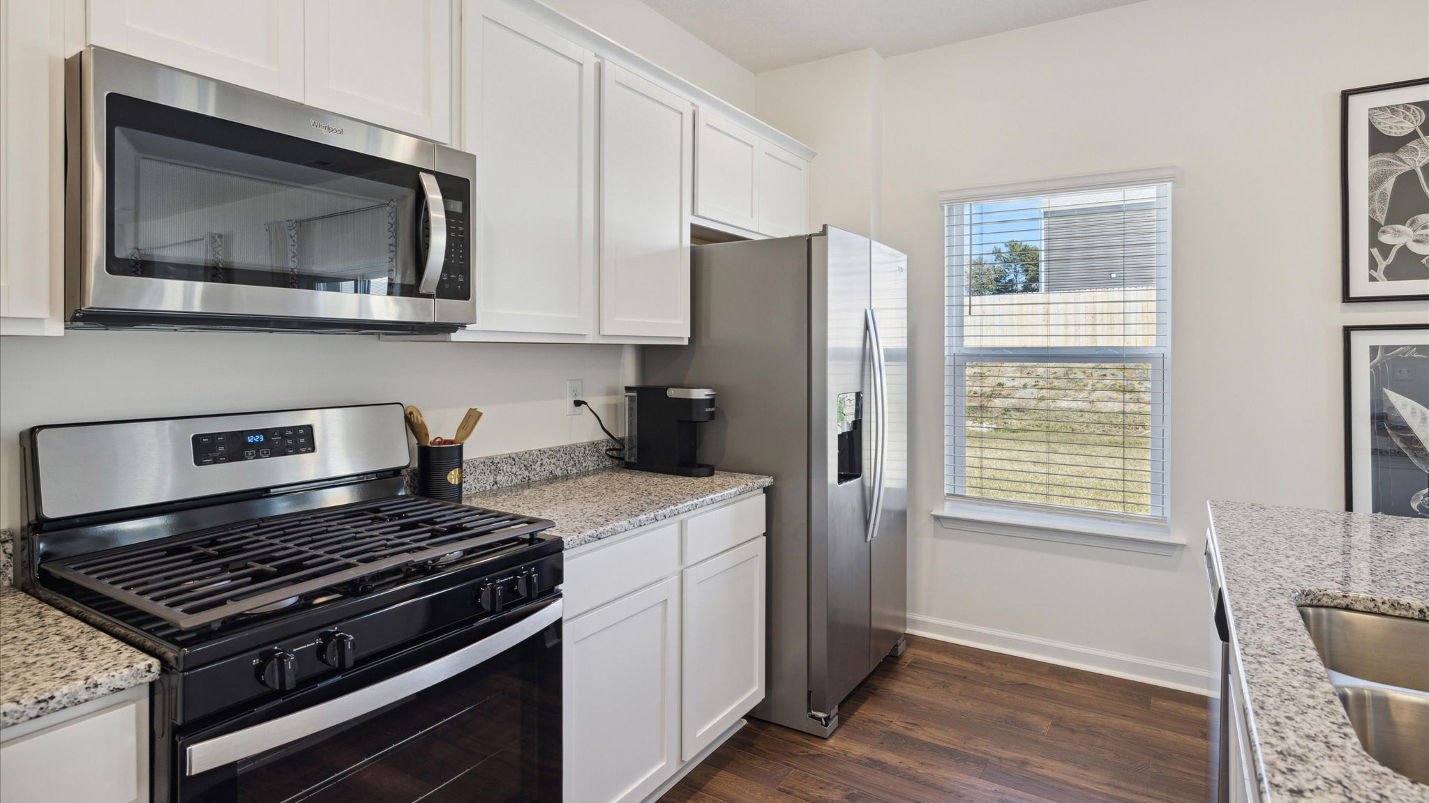 Open concept living, dining, and kitchen space