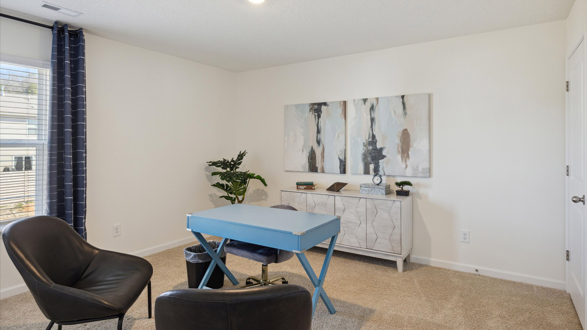 Bedroom with ample natural light and carpet floors