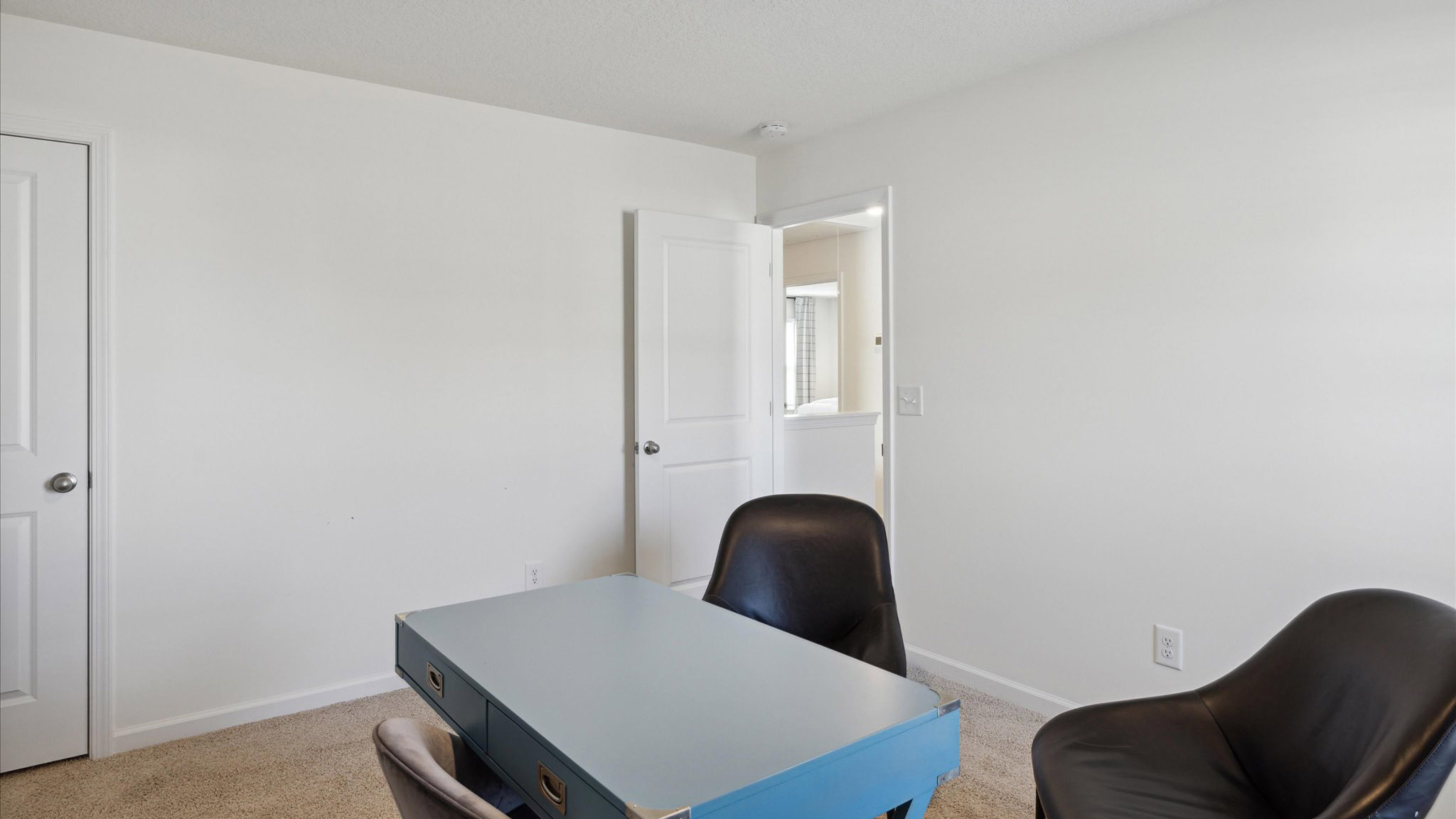 Bedroom with ample natural light and carpet floors