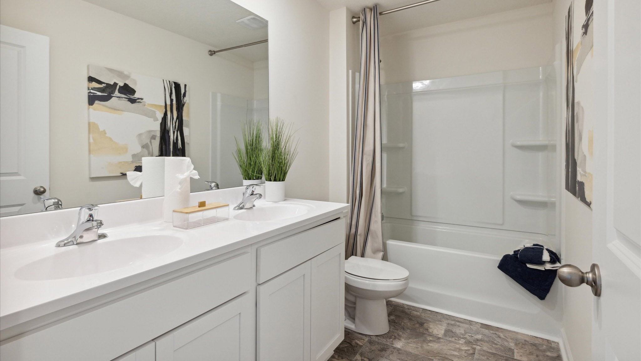 Guest bathroom with built in vanity and combination bathtub shower