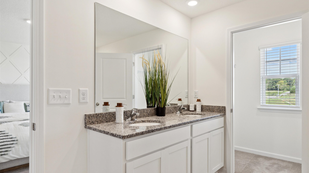 Primary bathroom with double vanity and walk-in shower