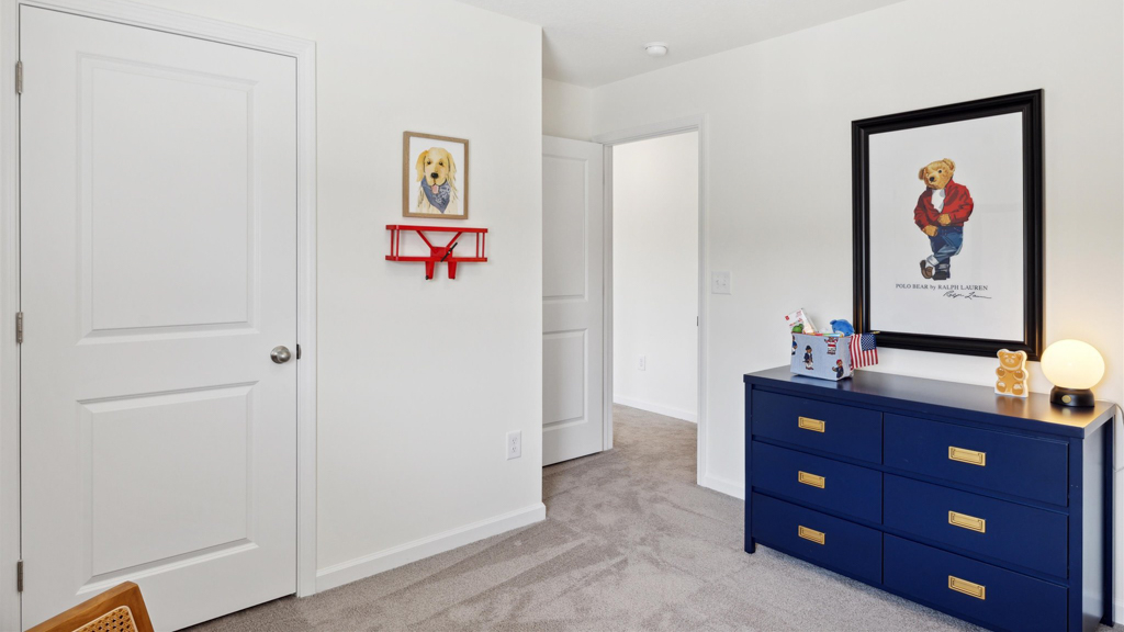 Bedroom with ample natural light and carpet floors