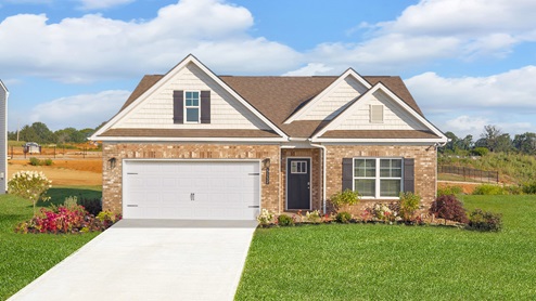 front exterior of a one story home with white siding, brick accents and a two car garage