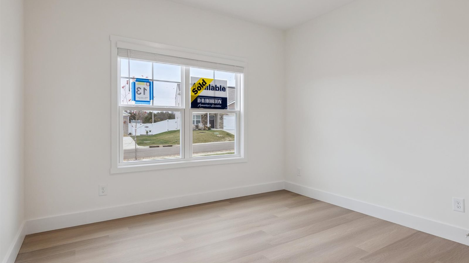 Guest bedroom 2 with front windows and ample natural light