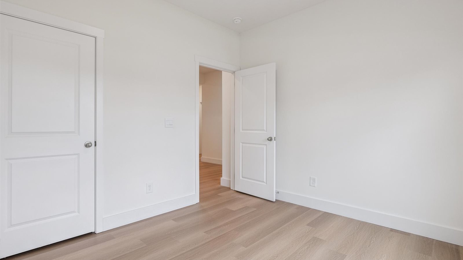 Guest bedroom 1 with front windows and ample natural light