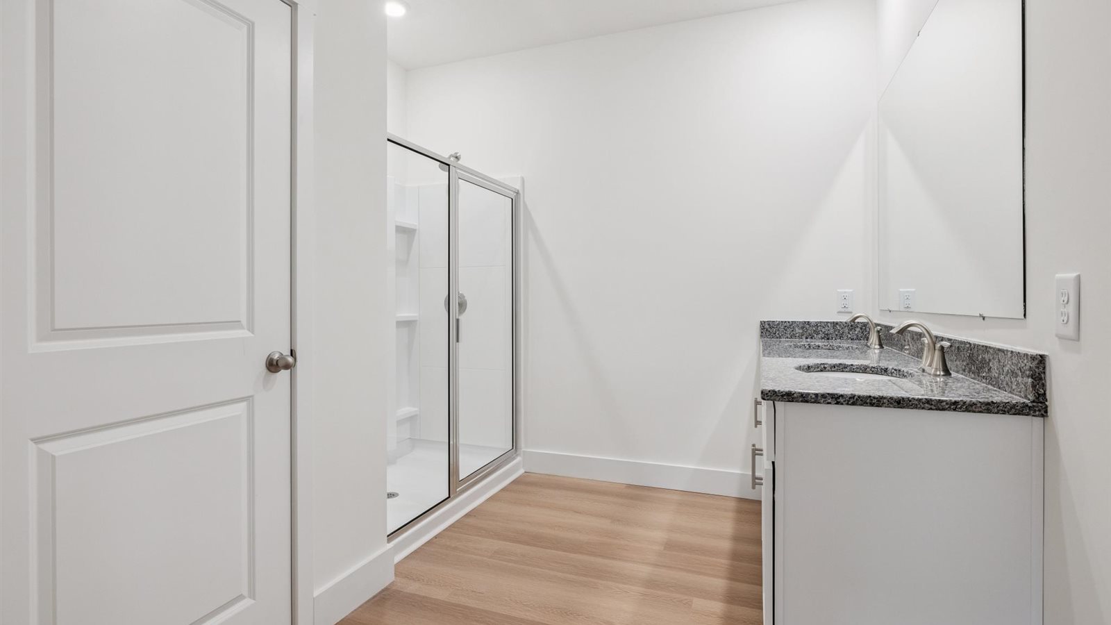 Primary bathroom with luxurious shower and built in storage