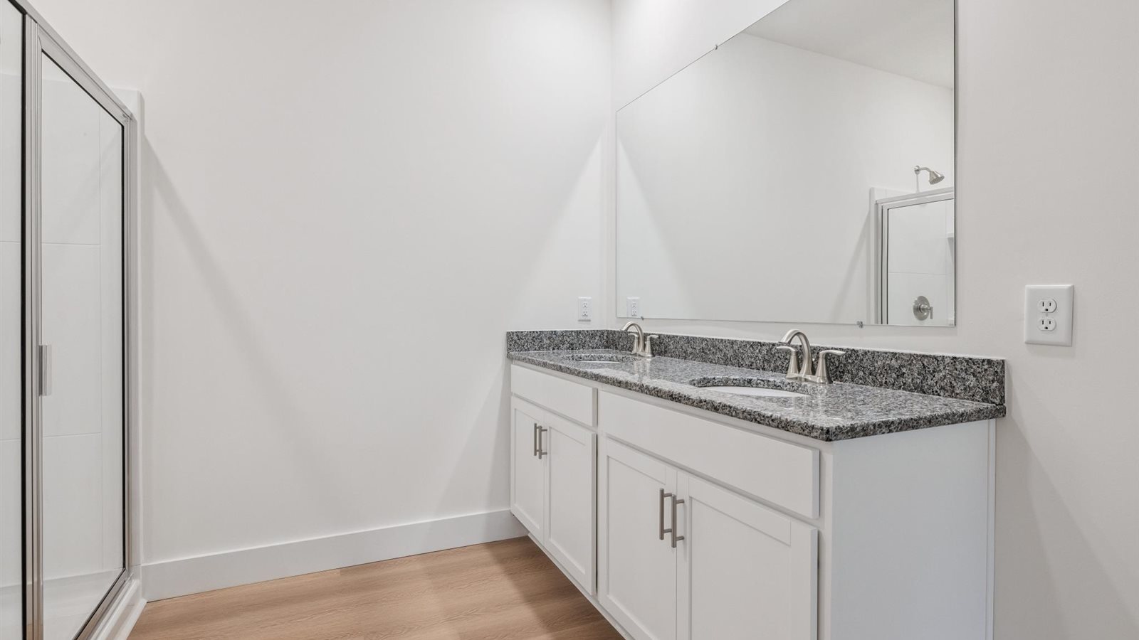 Private attached primary bathroom with built in vanity
