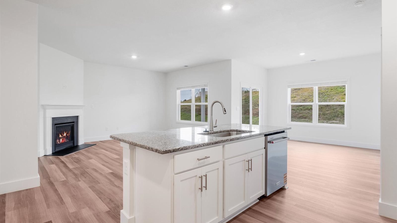 Spacious open concept kitchen with island and counter prep space